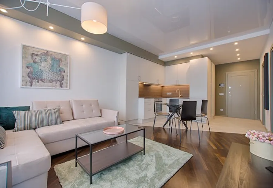 Modern apartment interior with open kitchen and dining area